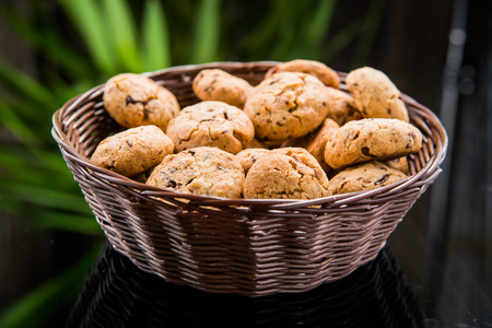 cookies with chocolate and raisins on a plateの写真素材