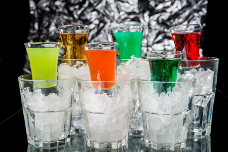 Alcoholic cocktail on the bar, close-up in glassの写真素材