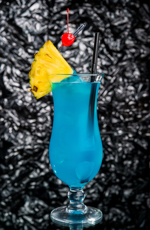 Alcoholic cocktail on the bar, close-up in glassの写真素材