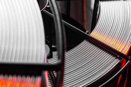 welding wire, stainless steel, on a black backgroundの写真素材