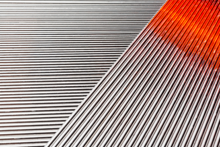 Abstract background of stainless welding rods, on a black background