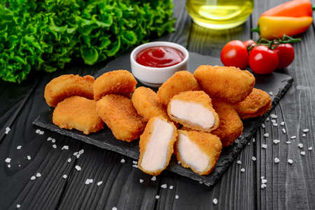 Meat nuggets with sauce and spices, fast foodの写真素材