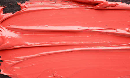 Paint texture on a dark background.