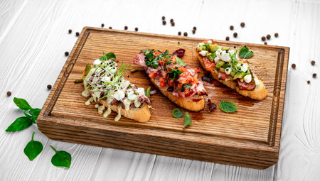 Assorted bruschetta with various toppings.Appetizing bruschetta.Variety of small sandwiches.Mix bruschettaの写真素材