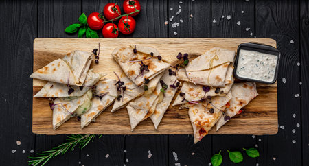 Fried pita bread with cheese and tomatoes. Serving food at the bar