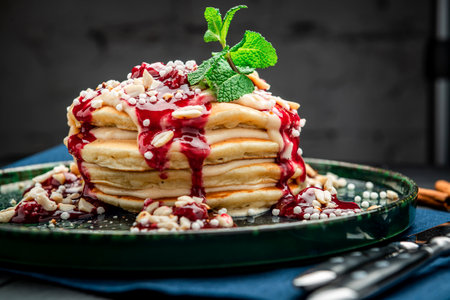 Pancake tower with yogurt, nuts and cherry jam. Healthy and wholesome food. Serving food in a restaurant. Photo for the menu.の写真素材