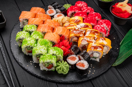 Big set of Asian food. Sushi and rolls on a dark background. healthy foodの写真素材