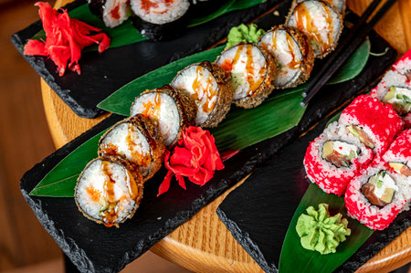 Big set of Asian food. Sushi and rolls on a dark background. healthy foodの写真素材