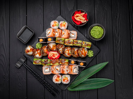 Big set of Asian food. Sushi and rolls on a dark background. healthy foodの写真素材