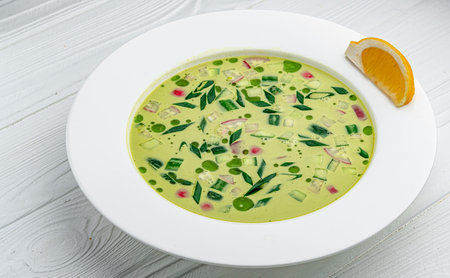 Okroshka, summer, cold soup with vegetables, fresh herbs and kefir. Healthy and delicious food. Photo for the menu.の写真素材