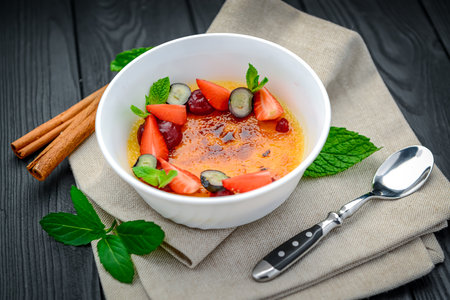 Creme brulee with fruits and berries. Serving food in a restaurant. healthy foodの写真素材