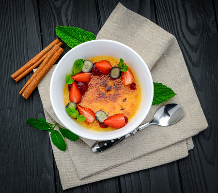 Creme brulee with fruits and berries. Serving food in a restaurant. healthy foodの写真素材