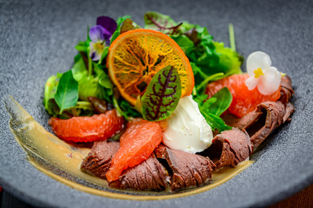 Fresh salad with roast beef, grapefruit and cream cheese. healthy food.の写真素材
