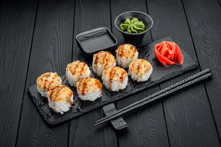 Sushi roll volcano, rolls with fish and cheese. Serving rolls in a restaurantの写真素材