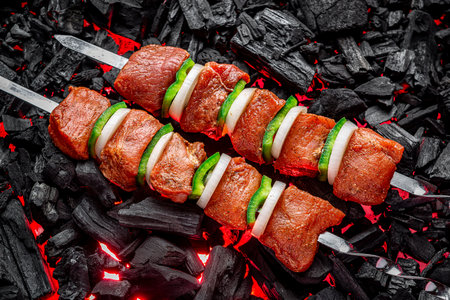 Fresh meat shish kebab cooked on charcoal. Shashlyk on the grillの写真素材