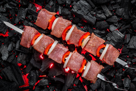 Fresh meat shish kebab cooked on charcoal. Shashlyk on the grillの写真素材
