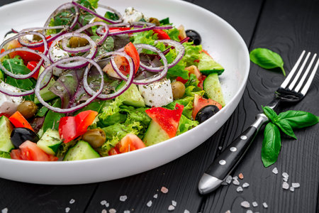 Greek salad with olive oil, fresh vegetables, olives and fetta cheese. Health food.の写真素材