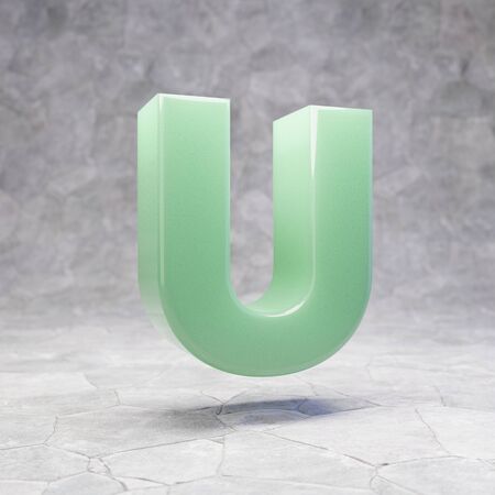 Jade letter U uppercase on rocky backgrond. 3D rendered jade gemstone font. Best for jewelry advertising, anniversary, celebration.の写真素材