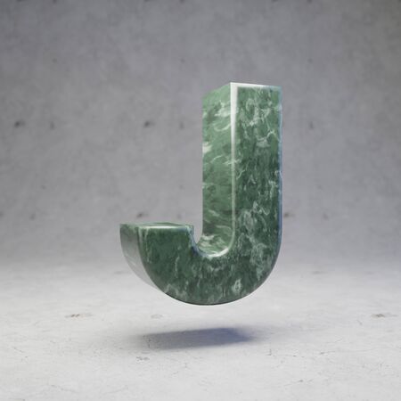 Green marble letter J uppercase on concrete background. 3d rendered glossy stone font character.の写真素材