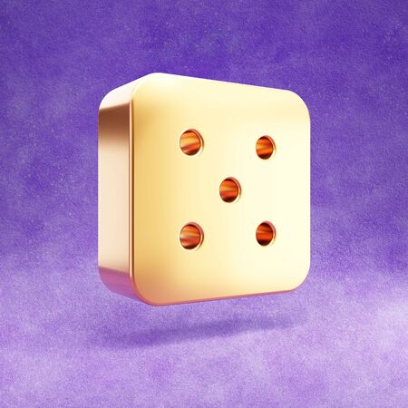 Dice five icon. Gold glossy Dice 5 symbol isolated on violet velvet background.の写真素材