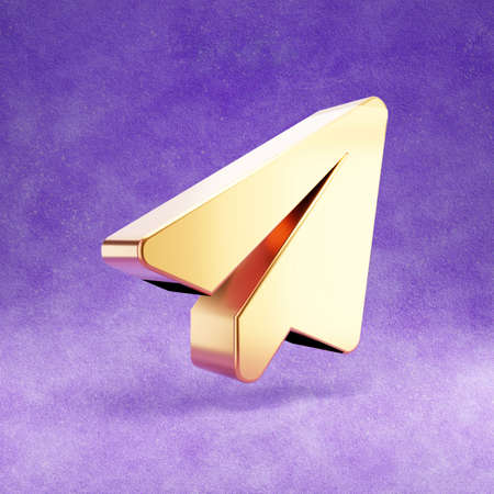 Paper plane icon. Gold glossy Paper plane symbol isolated on violet velvet background.