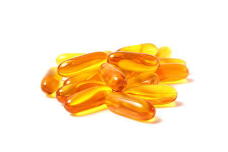 Omega-3 capsules on a white background. Fish oil, healthy supplementsの写真素材