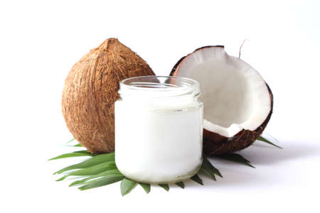 coconut oil and coconuts, palm branches close upの写真素材