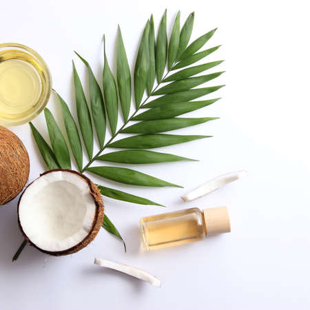 coconut oil and coconuts, palm branches close upの写真素材