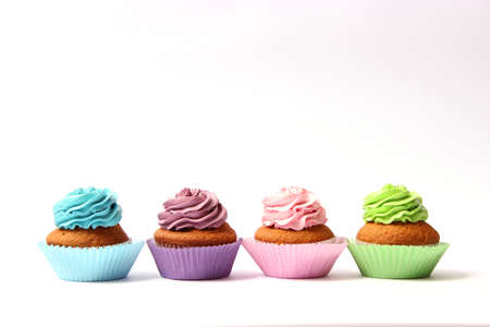 tasty cupcakes on a white background.の写真素材