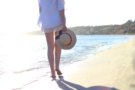 the girl is walking on the beachの写真素材