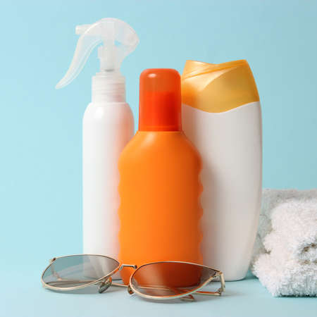 sunscreens on a colored background close-up. Sun protection for skin,の写真素材