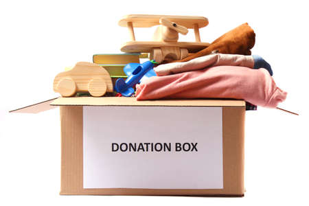 donation box with clothes and toys isolated on white