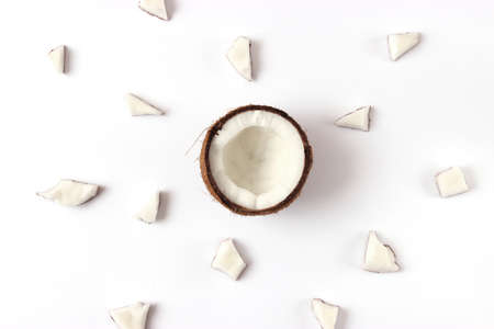 broken coconut on a white background top view.の写真素材