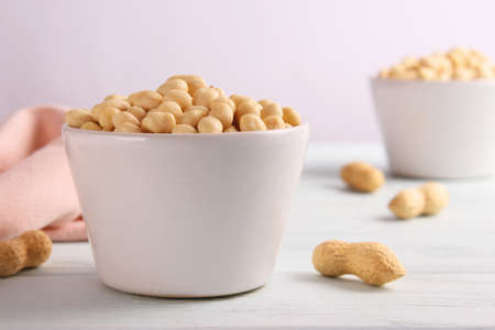 raw peeled peanuts on a light backgroundの写真素材