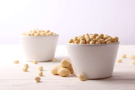 raw peeled peanuts on a light backgroundの写真素材
