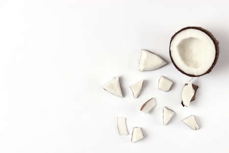 broken coconut on a white background top view.の写真素材