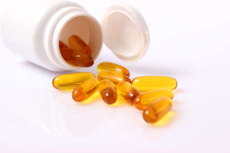 Omega-3 capsules on a white background. Fish oil, healthy supplementsの写真素材