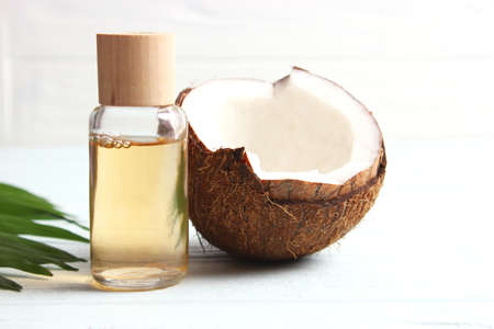 coconut oil and coconuts, palm branches close upの写真素材