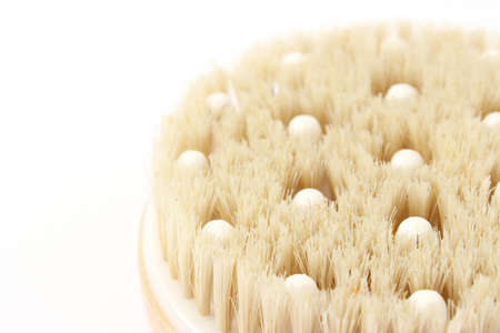 brush for dry massage on a white background isolated.の写真素材