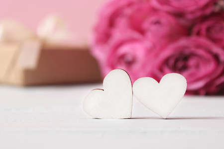 gift and flowers on a colored background. Holiday, give a gift, congratulationsの写真素材