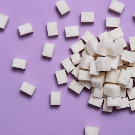 Refined sugar on a colored background. Diabetes concept, excess sugarの写真素材