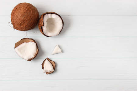 broken coconut on a colored background top view.の写真素材