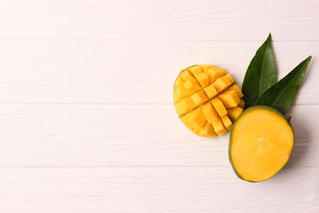 Fresh tropical mango fruit on wooden background top view.の写真素材