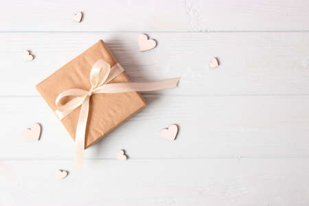gift and flowers on a colored background. Holiday, give a gift, congratulationsの写真素材