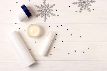 Winter care cosmetics on a colored background top view.の写真素材