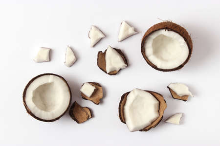 broken coconut on a white background top view.の写真素材