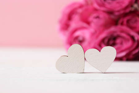 gift and flowers on a colored background. Holiday, give a gift, congratulations