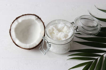 coconut oil and coconuts, palm branches close upの写真素材