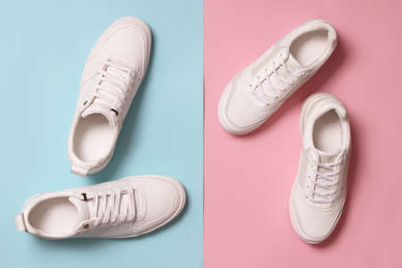 Mens and womens sneakers on a colored background top view. Sport shoes.の写真素材