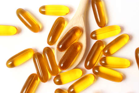 Omega-3 capsules on a white background. Fish oil, healthy supplementsの写真素材